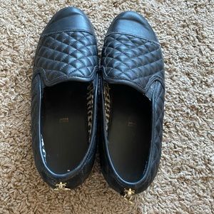 Black leather slip-on flats
